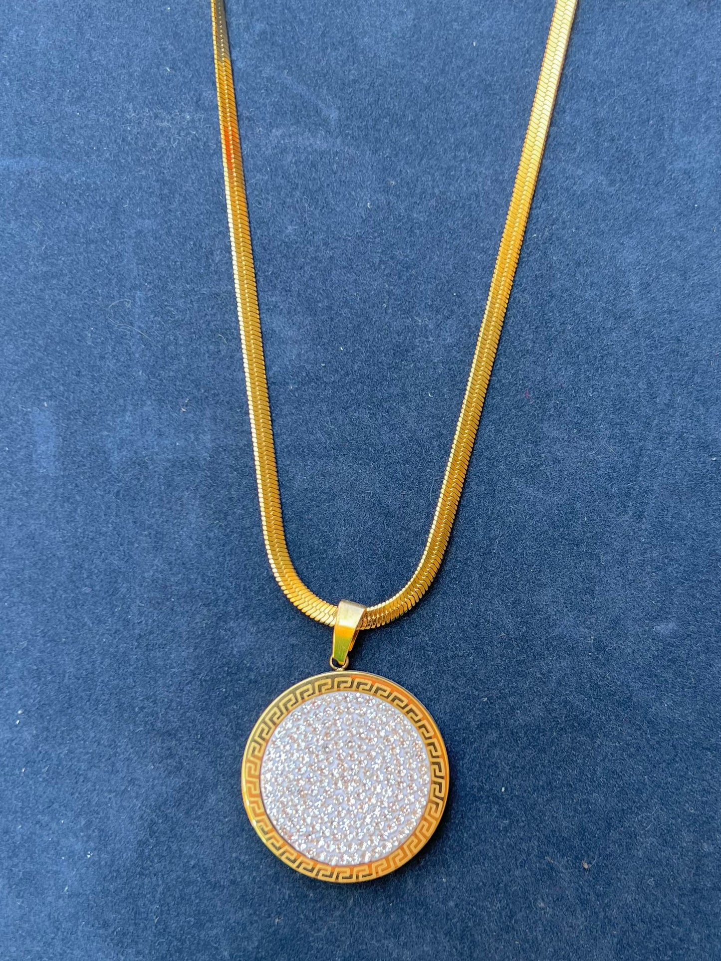 A necklace with circular stones.