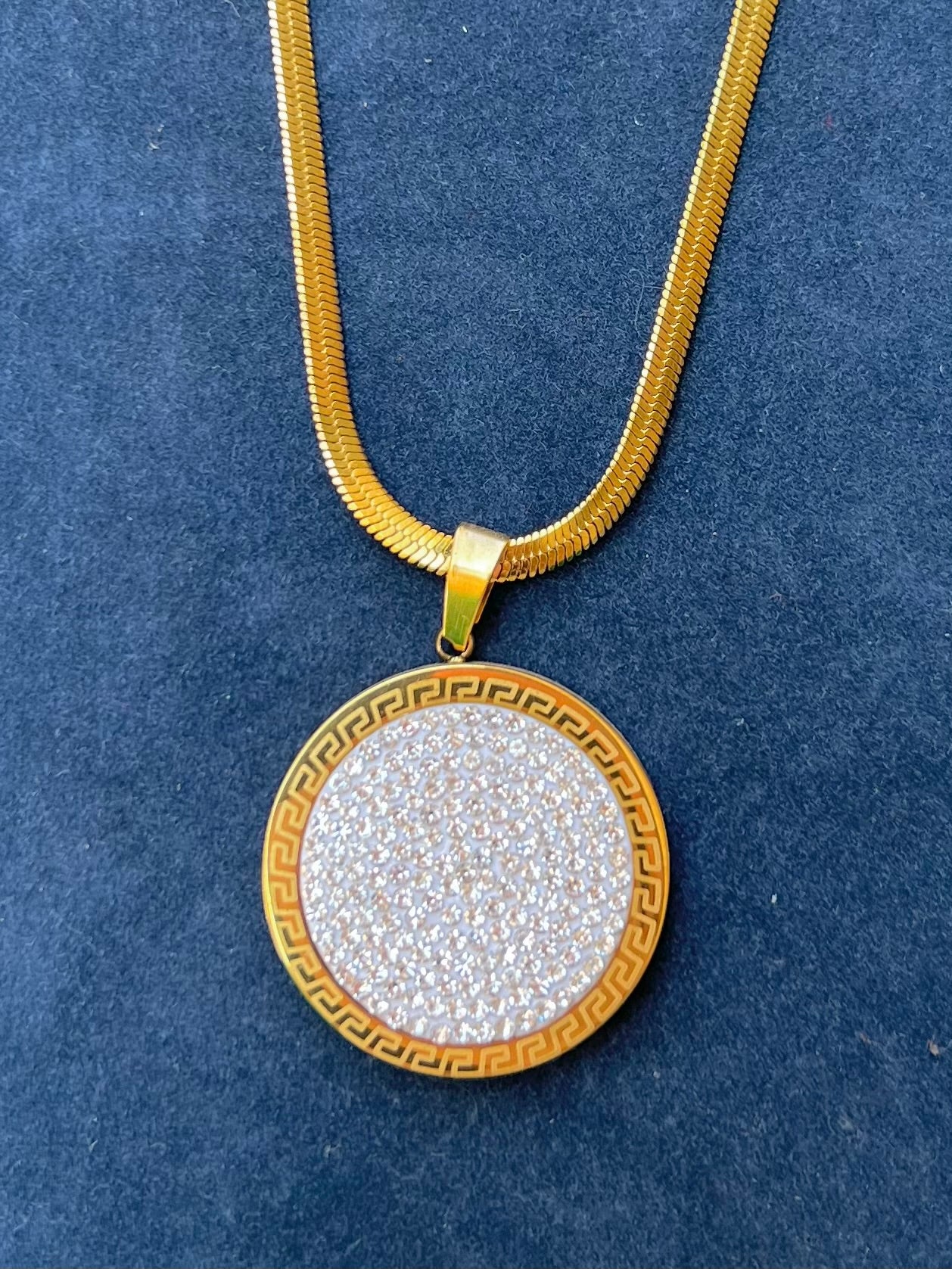 A necklace with circular stones.